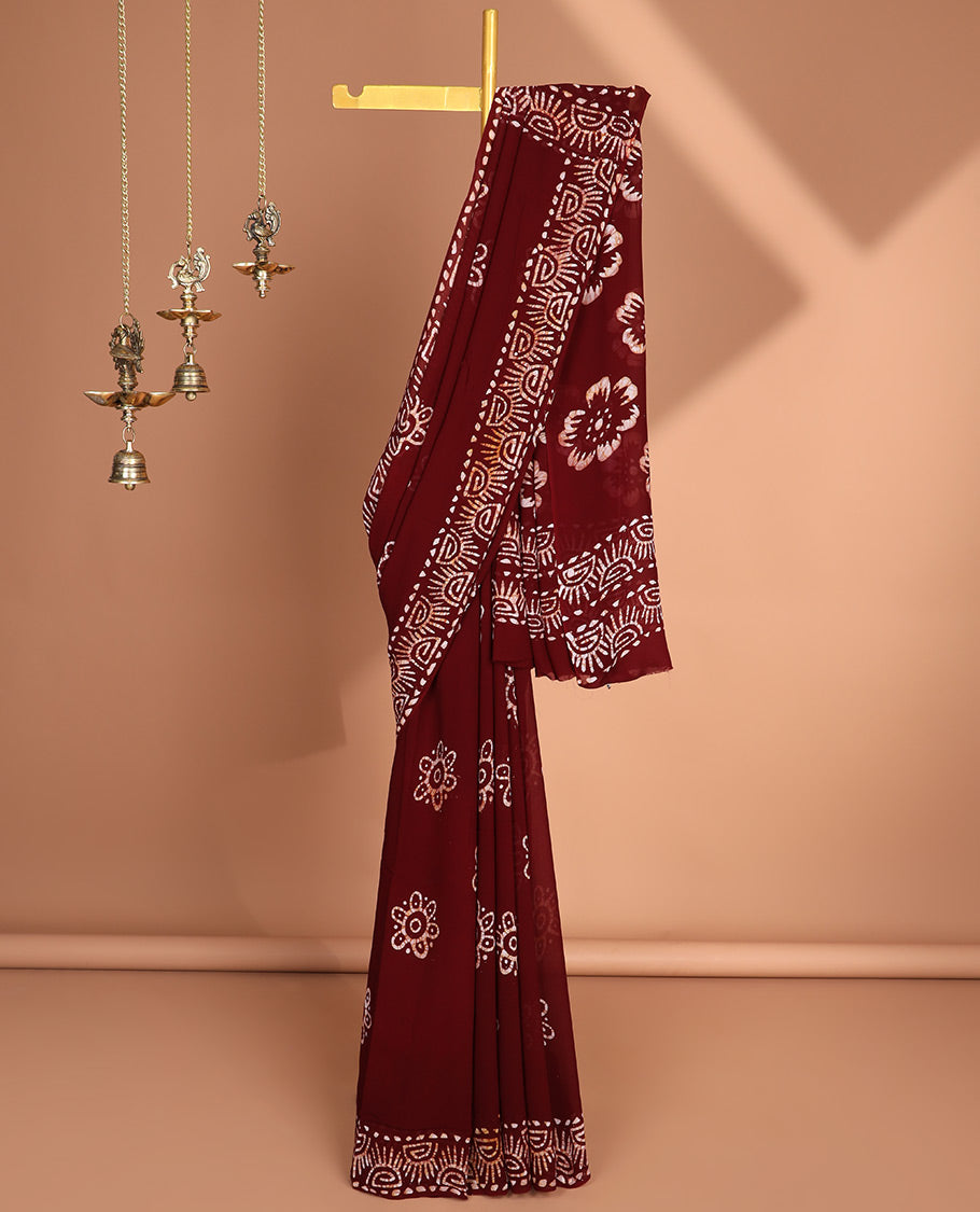 Maroon pathink print georgette saree with pathink print pallu & running blouse