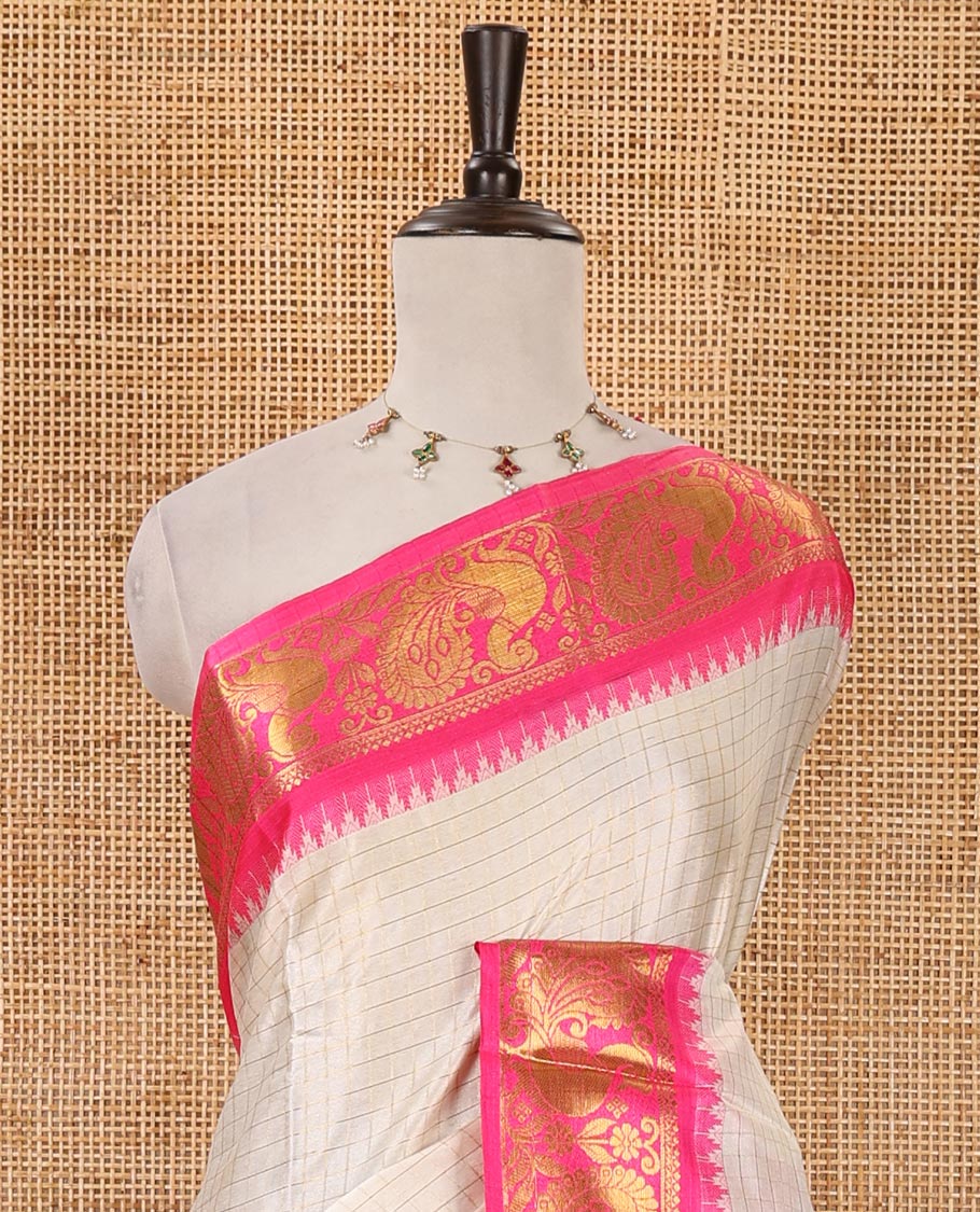 Half-white zari checked semi-taffeta silk saree, contrast rani pink annam motifs woven temple border, striped pallu & contrast striped zari border blouse