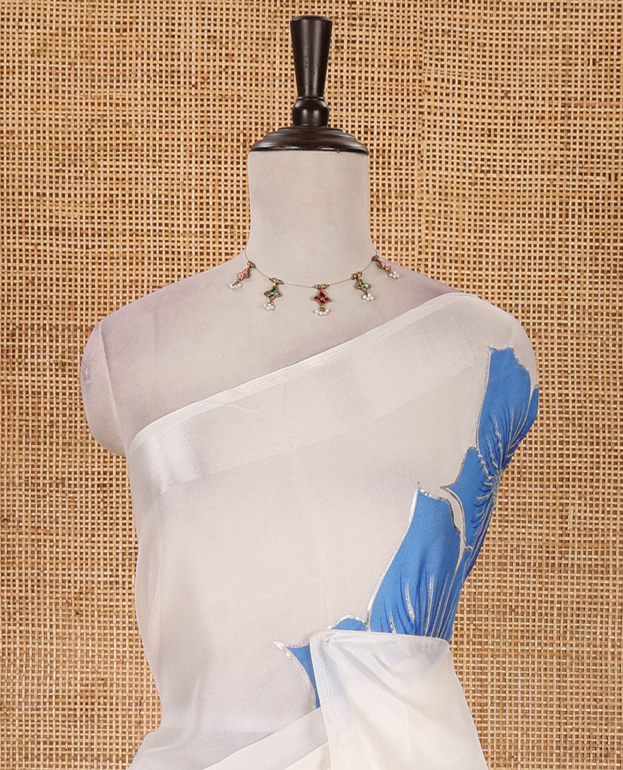 Cream floral placement-style printed Marble chiffon saree, zari border & contrast sky blue gotta patti work & mixed embroidered blouse