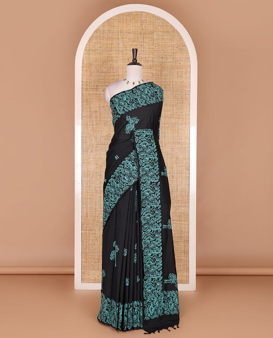 Black floral motifs hand block printed South cotton saree, floral hand block printed border and pallu, along with a contrast printed blouse