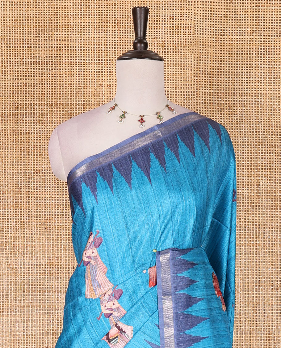 Dark blue Radha motifs printed katan silk saree, contrast temple border, ikkat motifs woven pallu, and contrast printed pallu