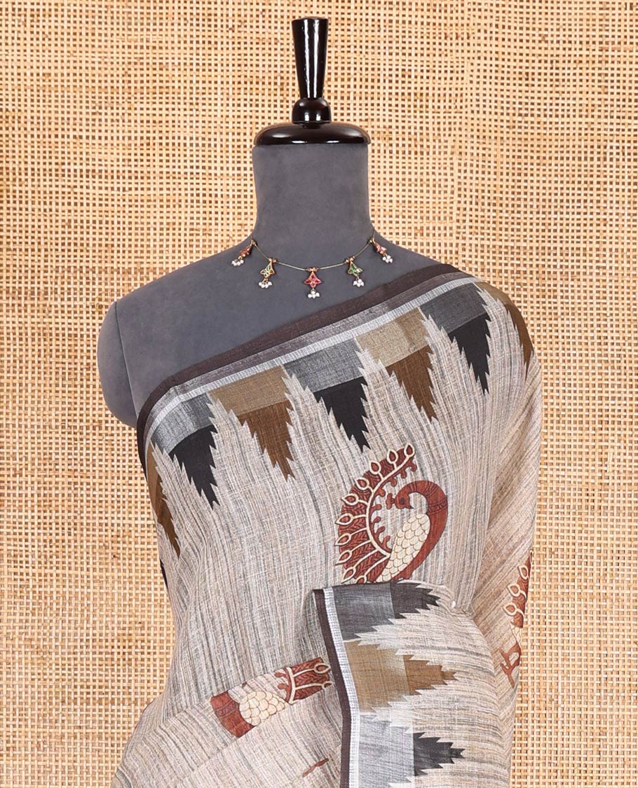 Chikku peacock motifs printed linen cotton saree, zari temple border, floral butta enclosed jaal printed pallu, and contrast buttas blouse