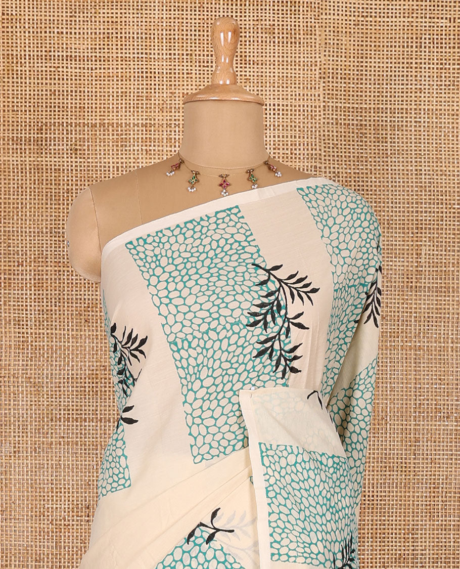 Cream plain South cotton saree, floral and honey hive printed border, a matching printed blouse, and a contrast floral vine printed blouse