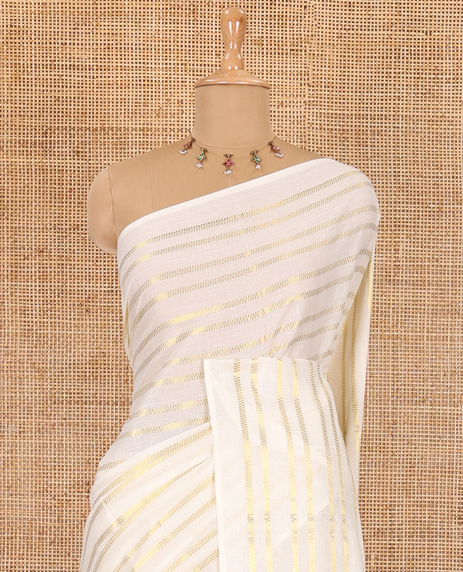 Borderless cream and ramar blue horizontal zari muthu striped Kerala cotton saree, self-pallu with tassels and a matching blouse