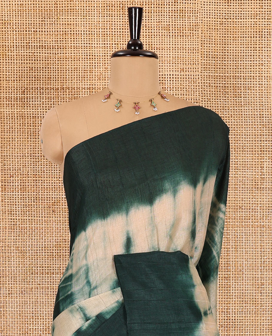 Rama green shibori printed jute cotton saree, contrast plain border, plain pallu with tussels, and contrast plain blouse