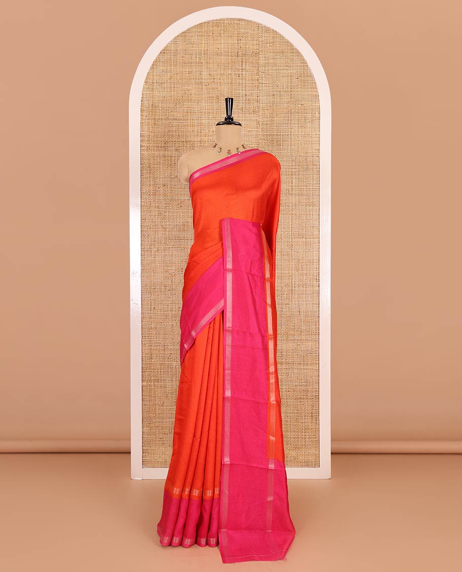 Orange embossed moss chiffon saree, contrast traditional rettai pettu border, embossed pallu, and a contrast embossed blouse
