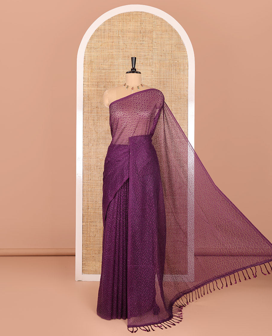Borderless violet sparkling glitter russel net saree with self-pallu, and a contrast floral printed and zig-zag patterned blouse