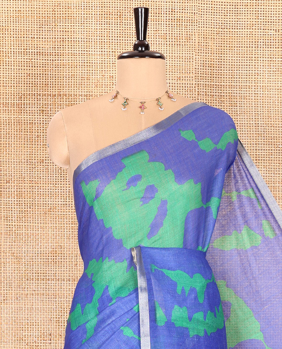 Royal blue shibori printed linen cotton saree, piping border, contrast floral printed pallu, and a contrast floral printed blouse