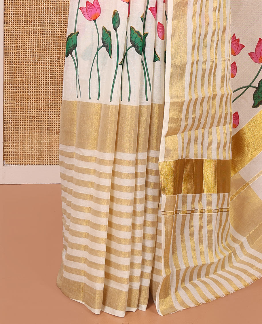 Cream Kerala Cotton Saree, Gleamed Up with Horizontal Zari Stripes and Pichwai Lotus Print All Over Its Body, Subtle Zari Border, Pallu Mirrors Pichwai Lotus Print, and Paired with a Matching Blouse
