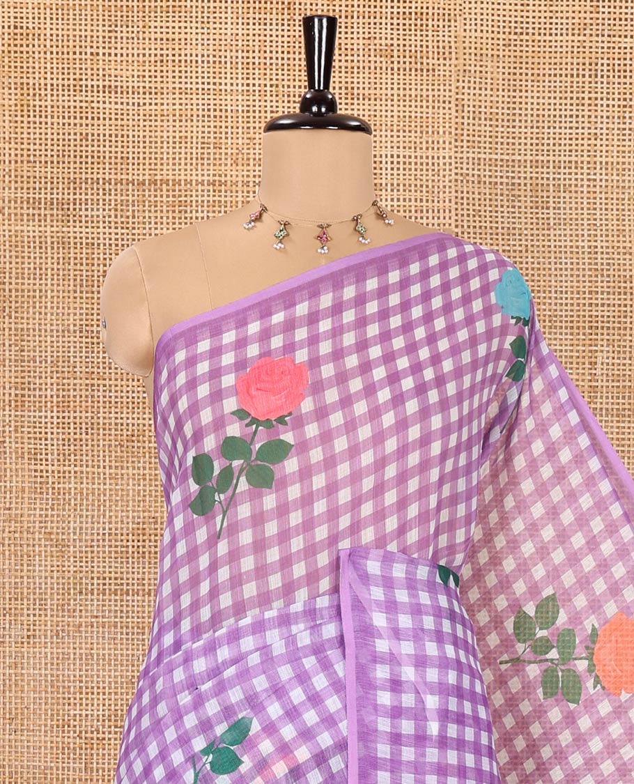 Borderless Lavender Linen Cotton Saree, Enlivened with Rose Floral Buttas and Checked Design on Its Body, Pallu Pictures a Beautiful Rose Floral Motifs, and Paired with a Matching Blouse