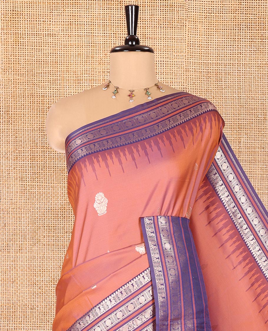 Onion Pink Elite Soft Silk Saree, Adorned with Zari Buttas All Over Its Body, Complemented by Contrast Temple Traditional Zari Border of Peacock-Rudraksham Motifs, Intricately Zari Woven Pallu and Paired with a Contrast Blouse