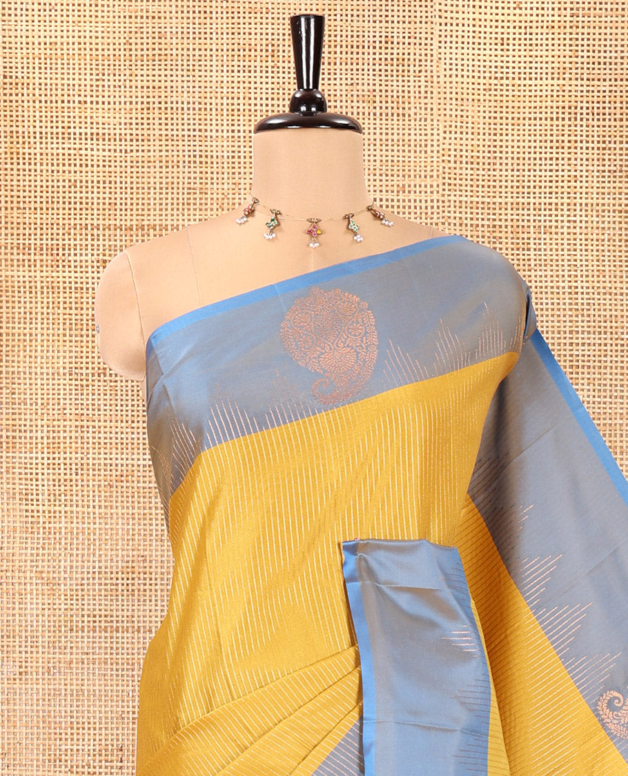 Mehendi Green Kanchi Soft Silk Saree, Majestically Detailed with Vaira Oosi, and Zari Buttas All Over Its Body, Complemented by Contrast Border of Paisleys, an Intricately Designed Pallu, and Paired with a Contrast Blouse