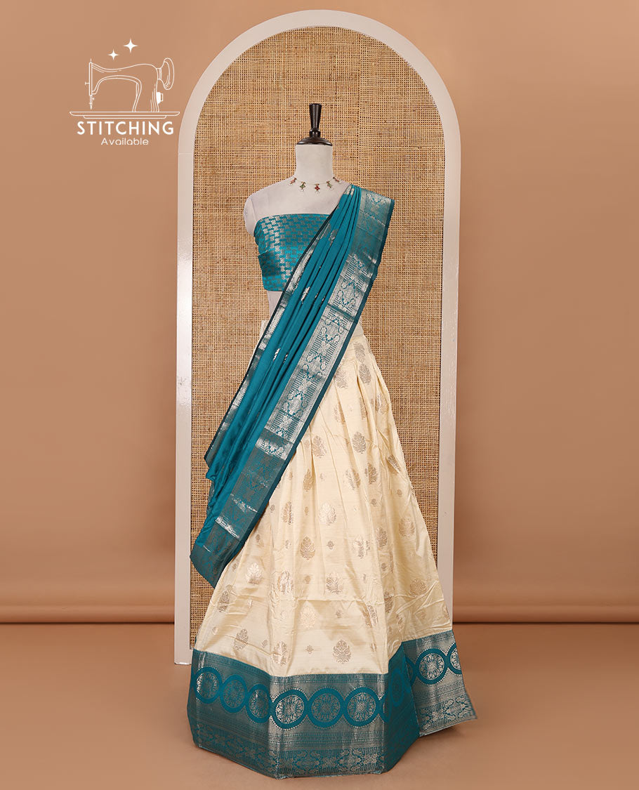 Cream-rama blue semi-banaras half-saree, zari buttas & contrast traditional zari border skirt, jacquard blouse & intricately zari woven dhavani