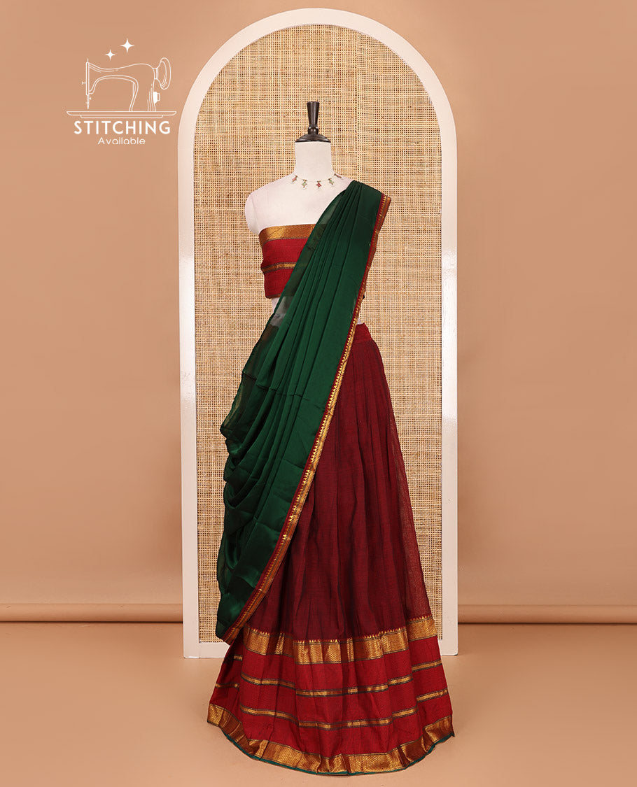 Maroon-green mercerised cotton half-saree, plain & contrast traditional zari big border skirt, traditional motifs matching blouse & contrast Syska georgette dhavani