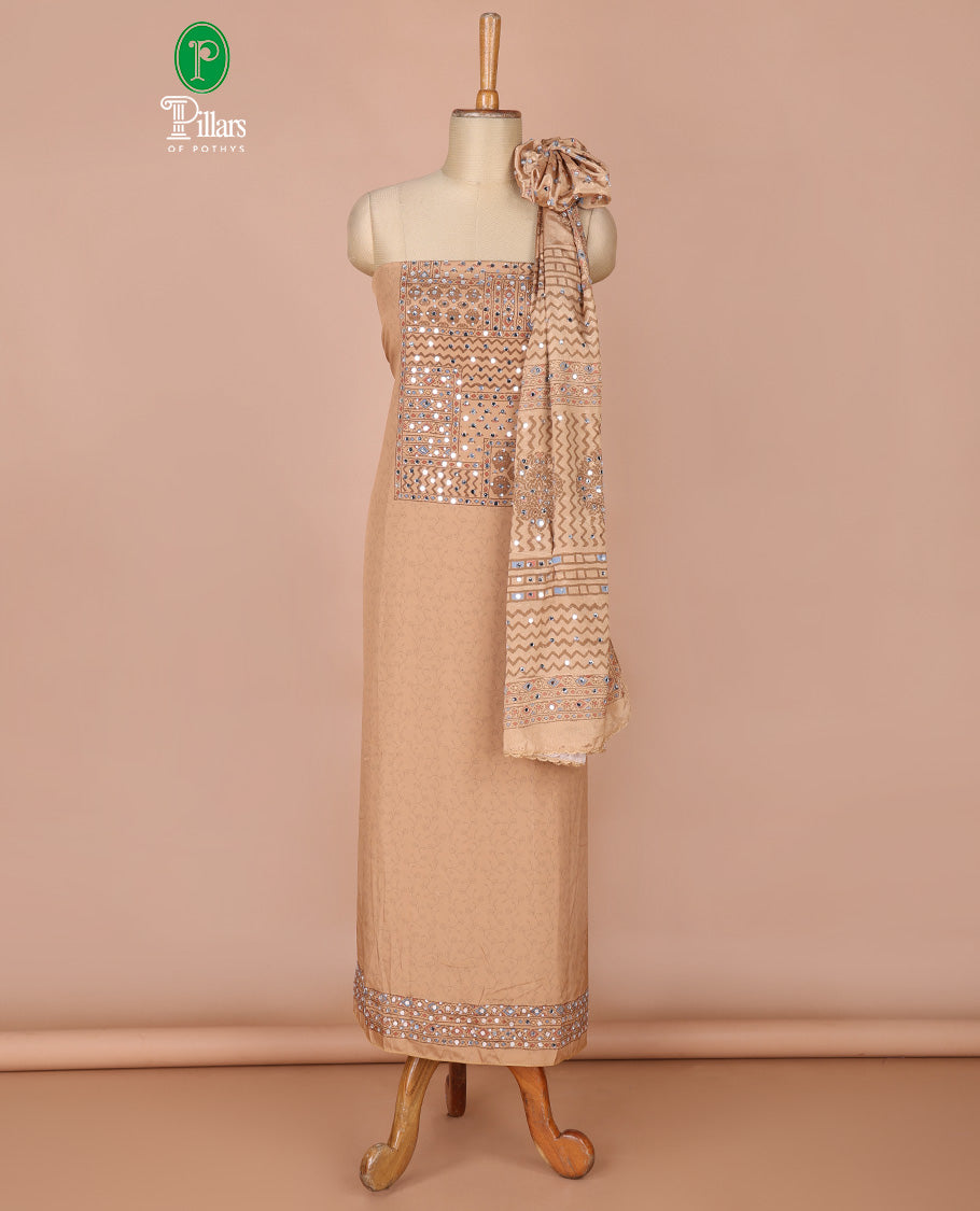Fawn self print , mirror work crepe chudidhar material top with americam crepe pants & self print, mirror work, lace border dupatta