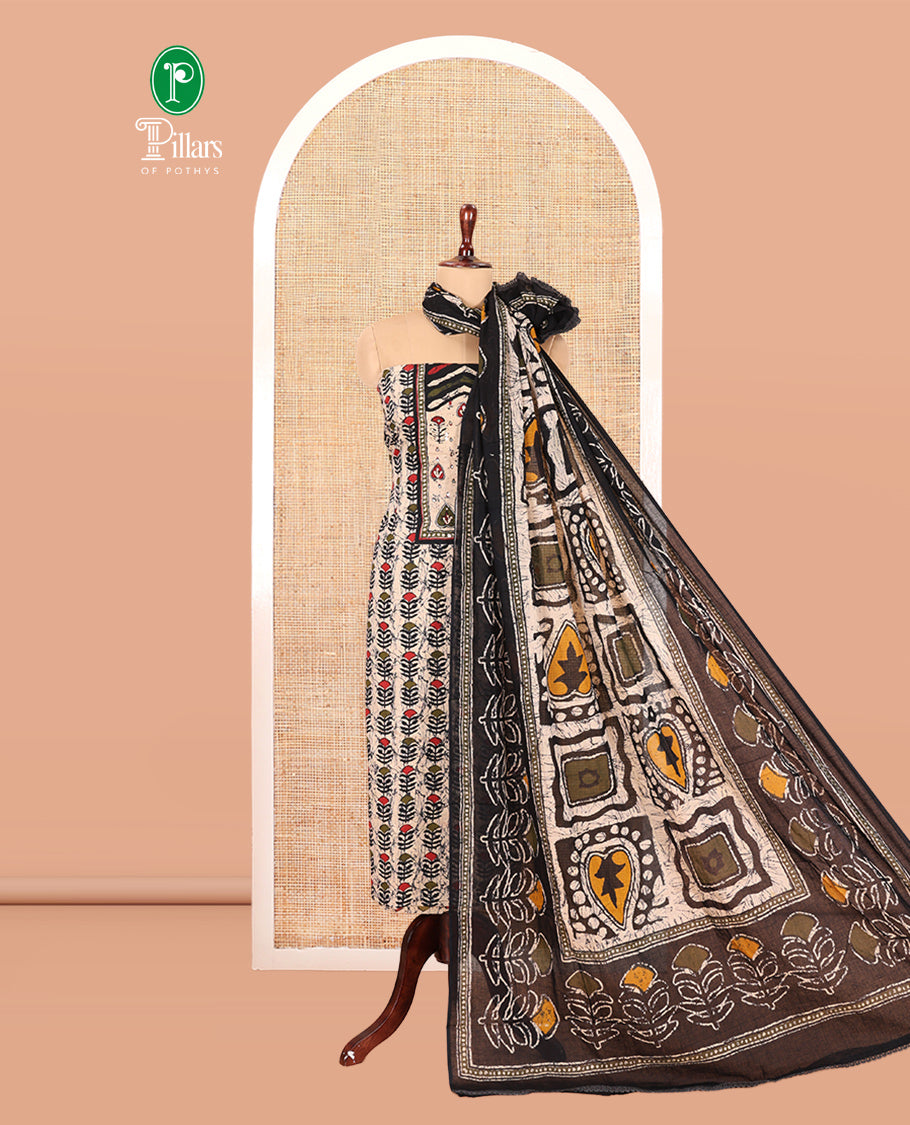 Black-Green Cotton Material Chudidar Features Batik-Printed Top, a Contrast-Printed Bottom, Batik-Printed Dupatta