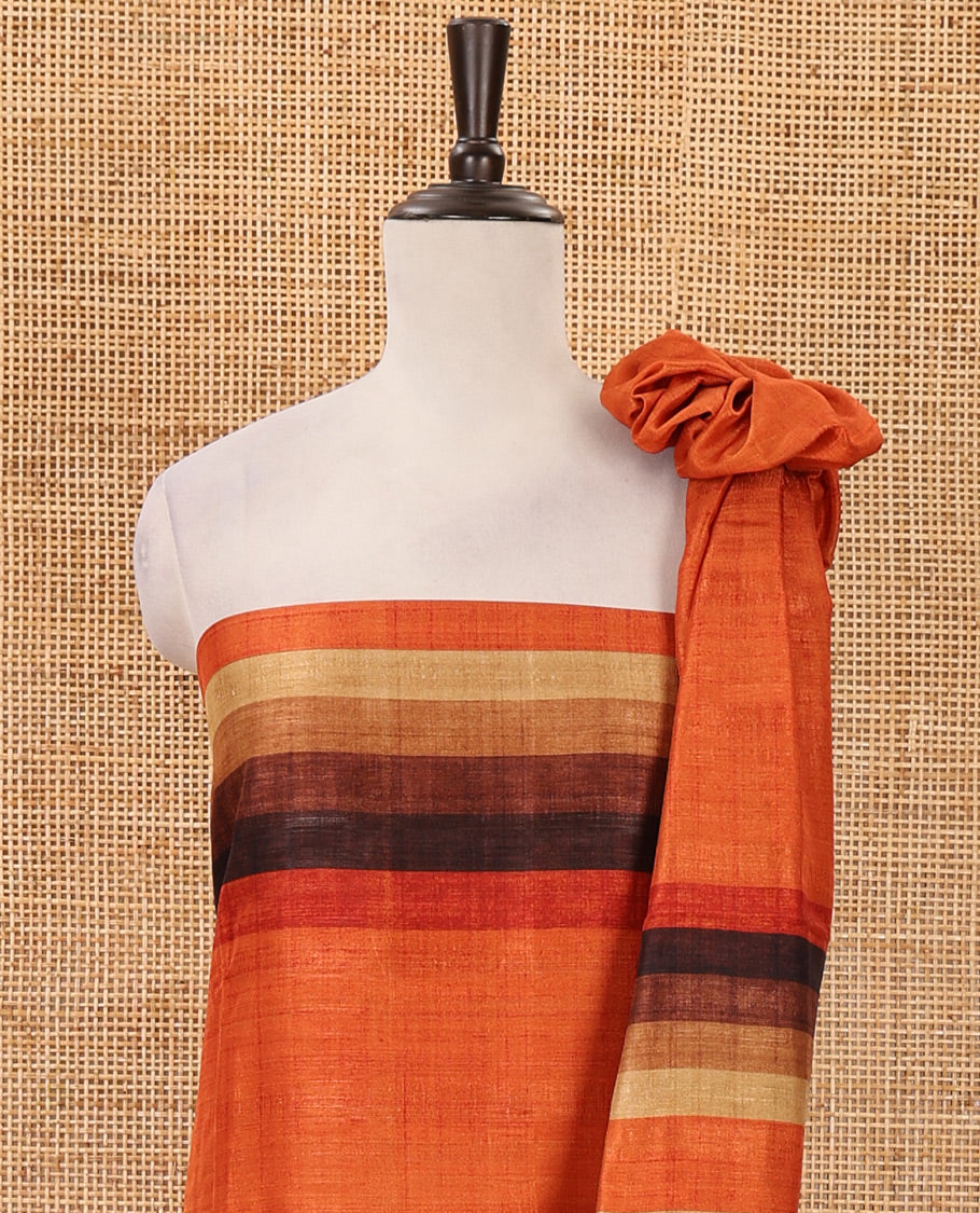 Burnt orange material chudidar set, horizontal ombre striped semi-tussar top, plain santoon bottom & horizontal ombre striped dupatta with tassels
