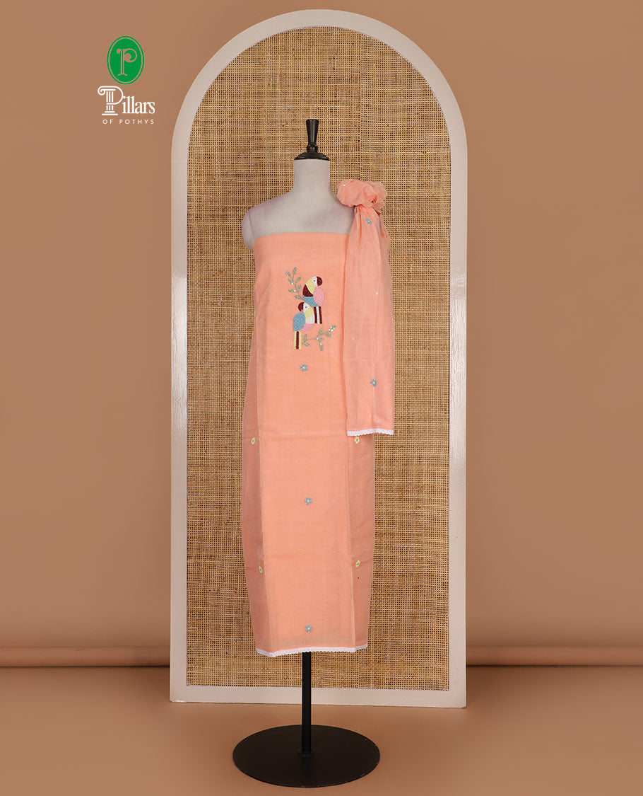 Peach net kota material chudidar set, macaw parrot, and flower motifs, multi-color sugar bead embroidered top, plain santoon bottom, and sugar bead embroidered dupatta