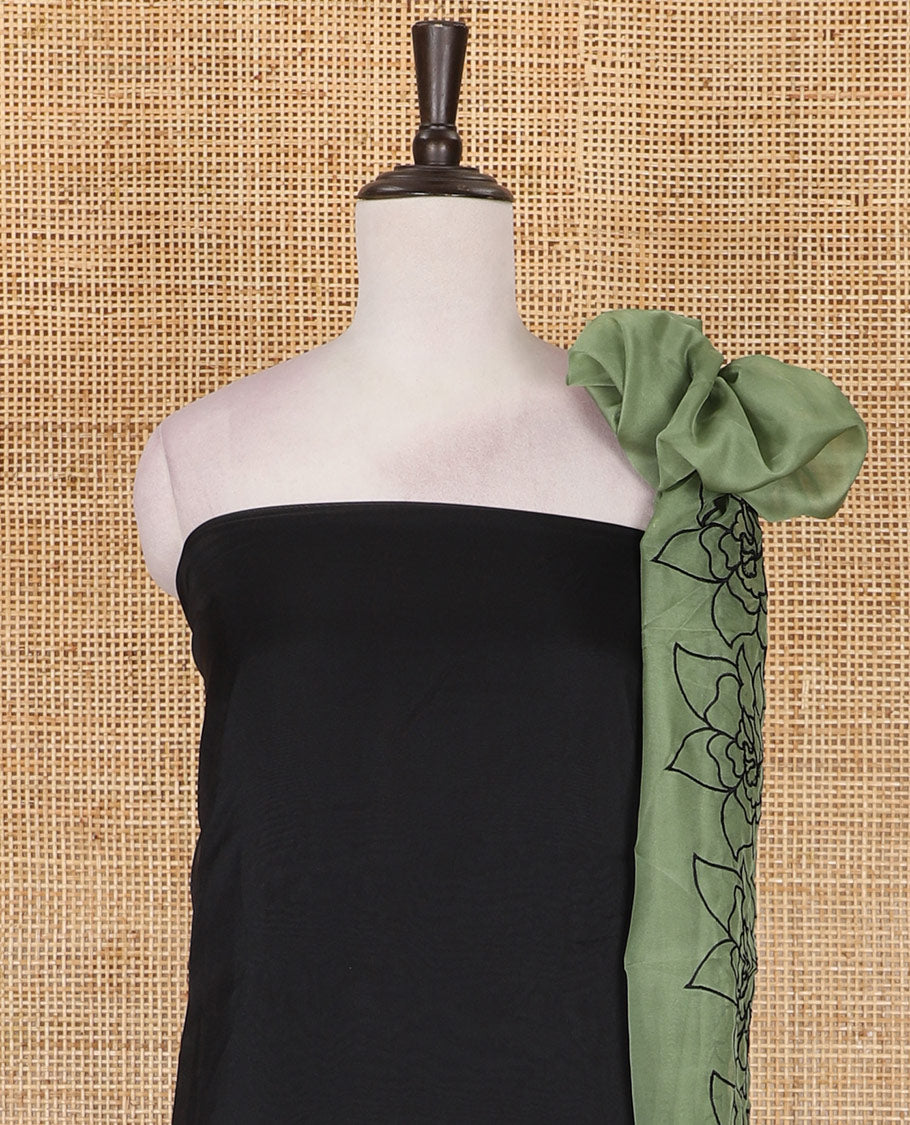 Black and green organza material churidar set, Lucknowi chikankari floral vine embroidery top, plain bottom, and contrast floral embroidery dupatta