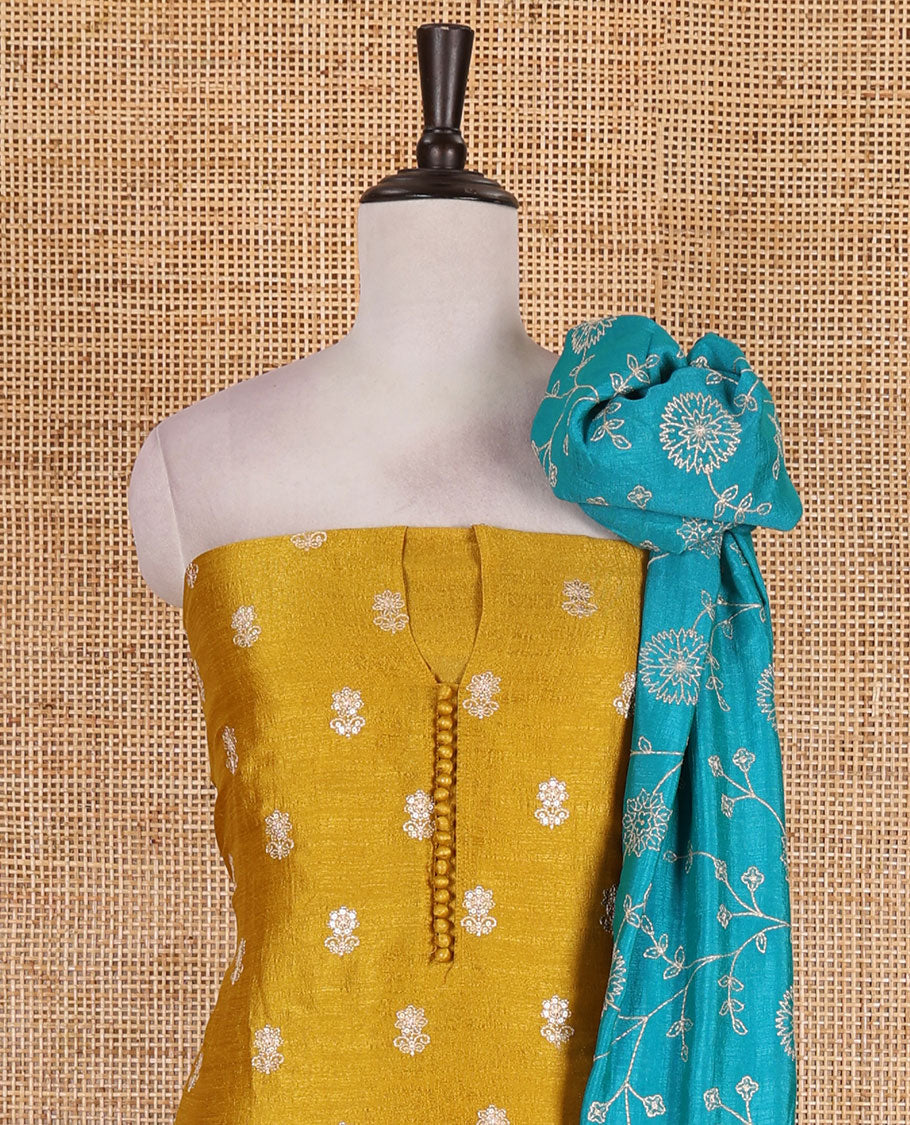 Mustard Vichitra silk material churidar set, floral motifs embroidered top, contrast Santoon bottom, and floral vine thread embroidered scallop dupatta