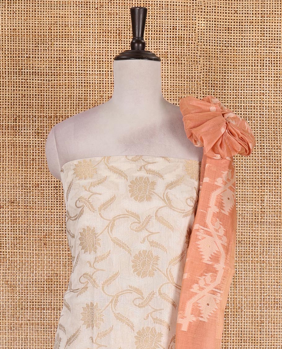 Cream with peach semi-chanderi material churidar set, floral jaal jacquard top, contrast taffeta silk bottom, and jamdani style dupatta