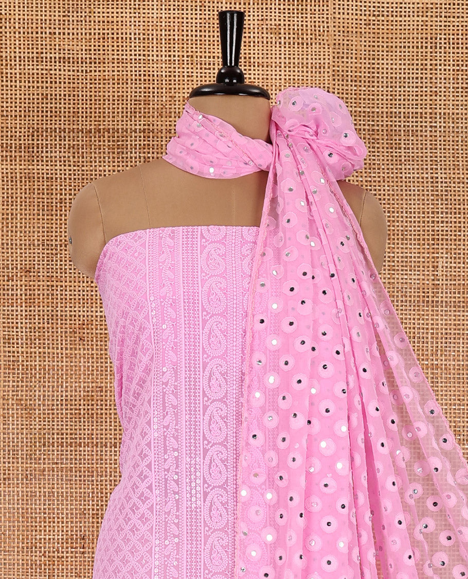 Pink material chudidar set, paisleys and jaal schiffli sequins embroidered mul georgette top, a matching bottom, and a mirror work dupatta