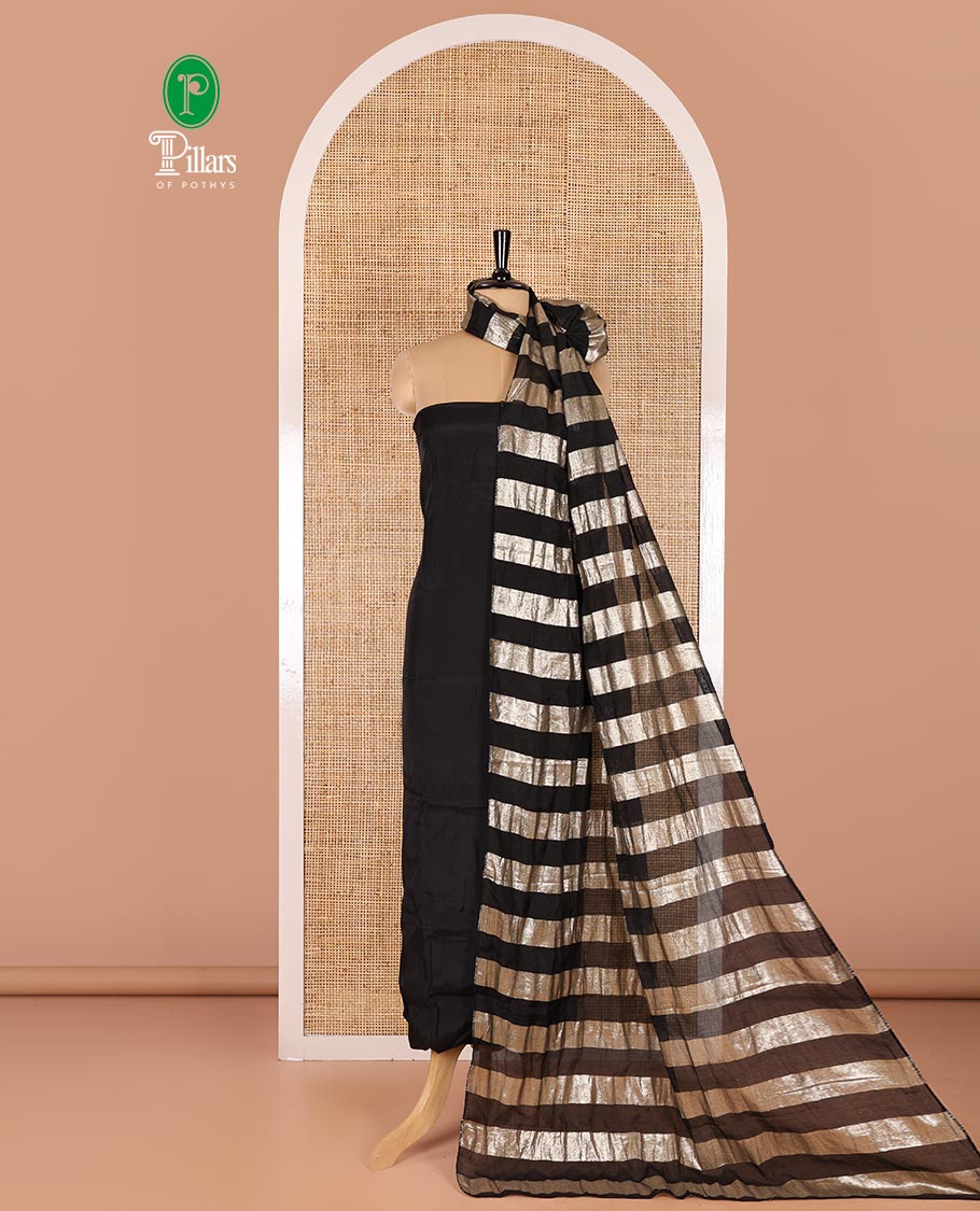 Black material chudidar set, plain with pom-pom tasseled mul chanderi top, a matching bottom, and organza dupatta of stripes