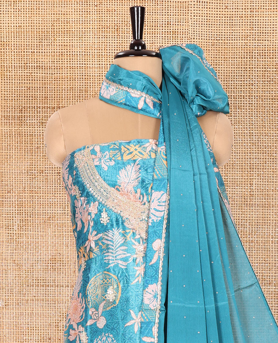 Blue Material Chudidar Set Embellished with Floral-Geometric Printed with Neck Embroidered Chinon Top, Subtly Made Plain Santoon Bottom, and a Chinon Dupatta Featuring Printed Border, and Glitter Dots