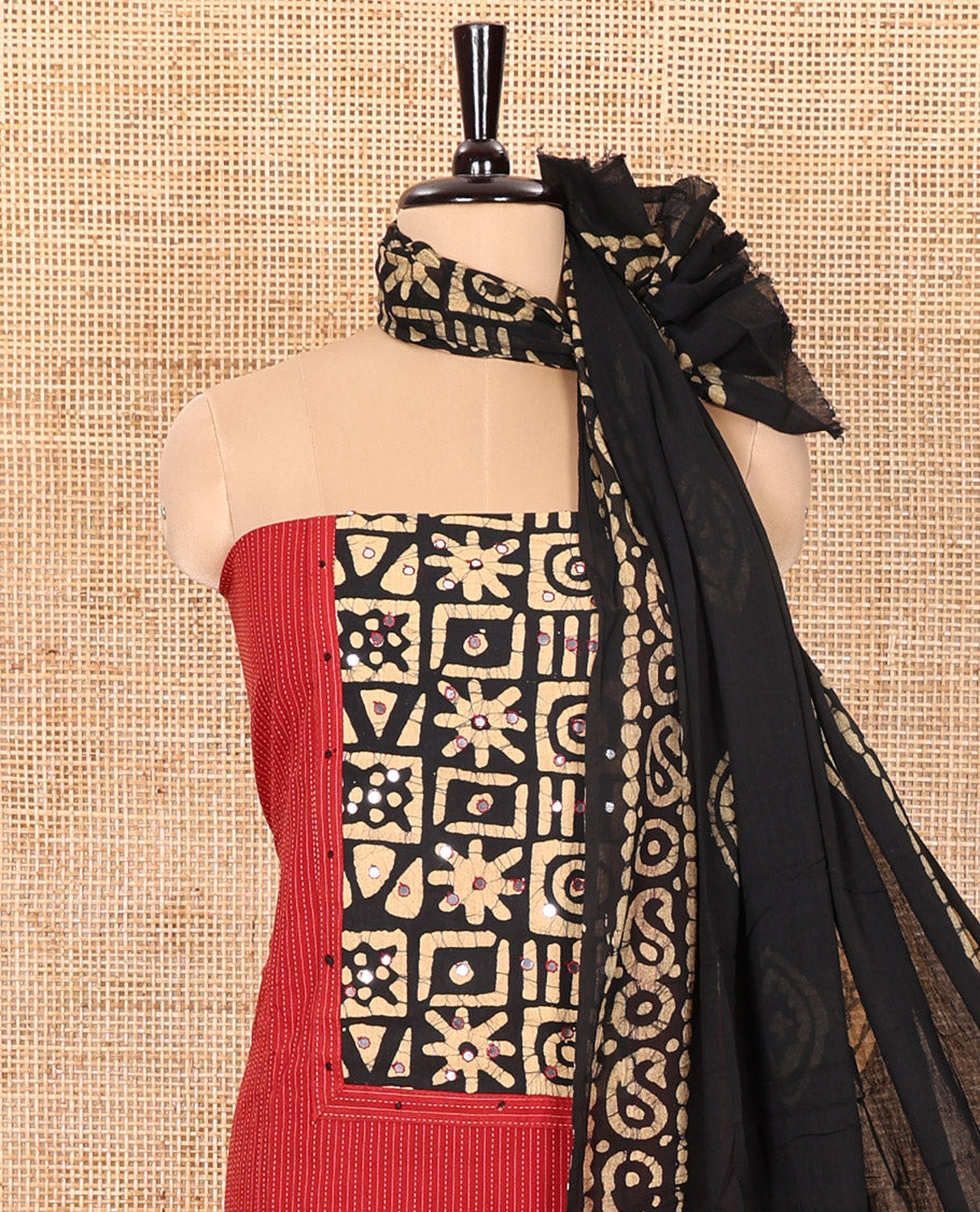 Red Material Chudidar Set Prettified with Kantha Embroidery, Batik Print, and Mirror Work on the Cotton Top, Comes with a Batik Geometric Patterns Printed Bottom, and a Cotton Batik Geometric Printed Dupatta