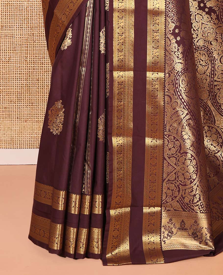 Brown Kanchipuram budget silk saree elevated with zari designs all over its body, complemented by rettai pettu traditional zari design border, Mughal-style intricately woven pallu, and paired with a Matching blouse