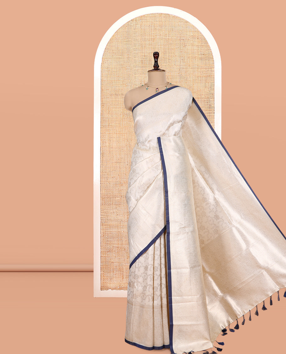 Off-White-Navy Semi-Silk Saree, Adorned with Floral Jacquard Design, a Zari Paisley Border, and a Contrast Blouse