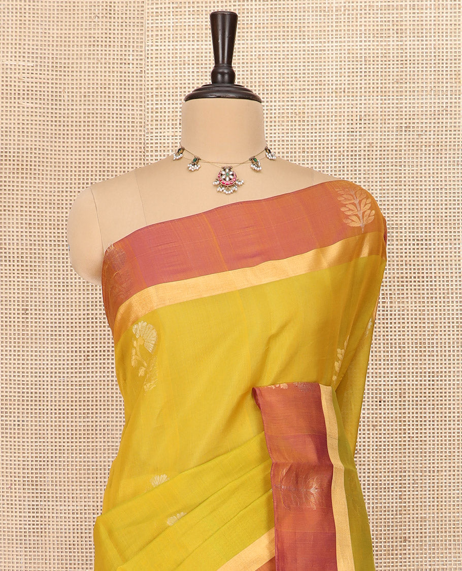 Green Silk Cotton Saree Graced with Floral Buttas All Over the Body, Complemented by a Contrast Floral Zari Motifs Woven Border, Featuring a Contrast Pallu of Floral- Geometric Zari Designs, and Paired with a Contrast Blouse