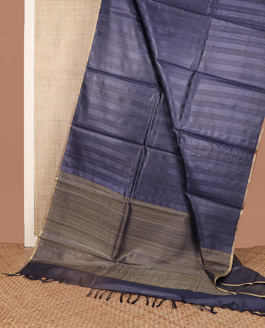 Borderless metallic blue sparsely striped tussar silk saree, striped pallu