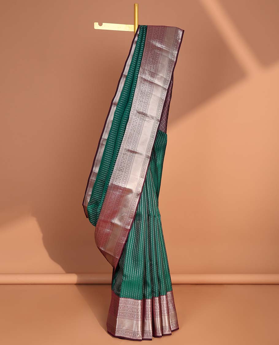 Green small buttas vasundhara elite silk saree with self intricate zari design border & pallu of argyle design