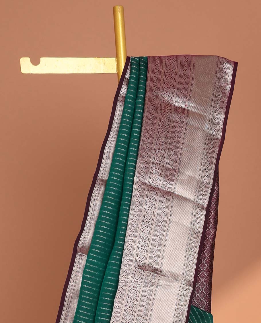 Green small buttas vasundhara elite silk saree with self intricate zari design border & pallu of argyle design