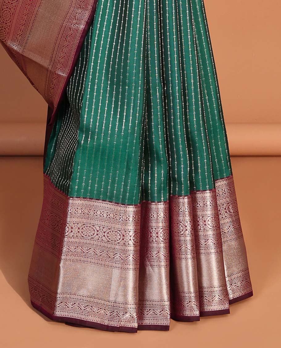 Green small buttas vasundhara elite silk saree with self intricate zari design border & pallu of argyle design
