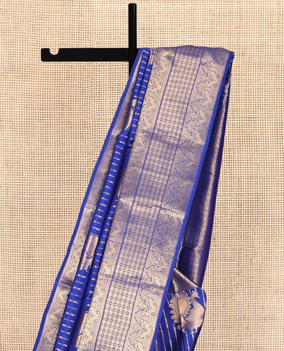 Blue Vasundhara Lite-Silk Mix Saree Featuring Zari Buttas and Stripes, Highlighted by Zari Border of Kamalam and Kili Designs, Butta-Enclosed Checked Pallu, and a Matching Blouse