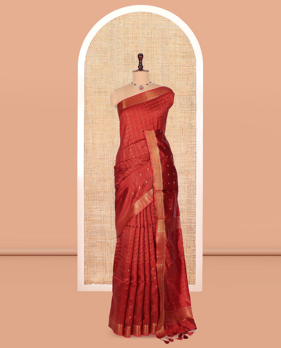 Rust Banana Pith Saree, Gleamed Up with Checks and Buttas, a Zari Temple Border, Striped Pallu, and Matching Blouse