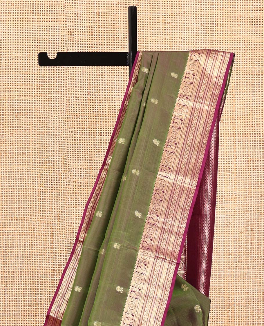 Green Vasundhara Silk Saree, Crafted with Zari Buttas All Over Its Body, Complemented by a Contrast Border of Rekku, Chakram, Neli, and Banaras Designs, Intricately Designed Pallu, and Paired with a Contrast Blouse