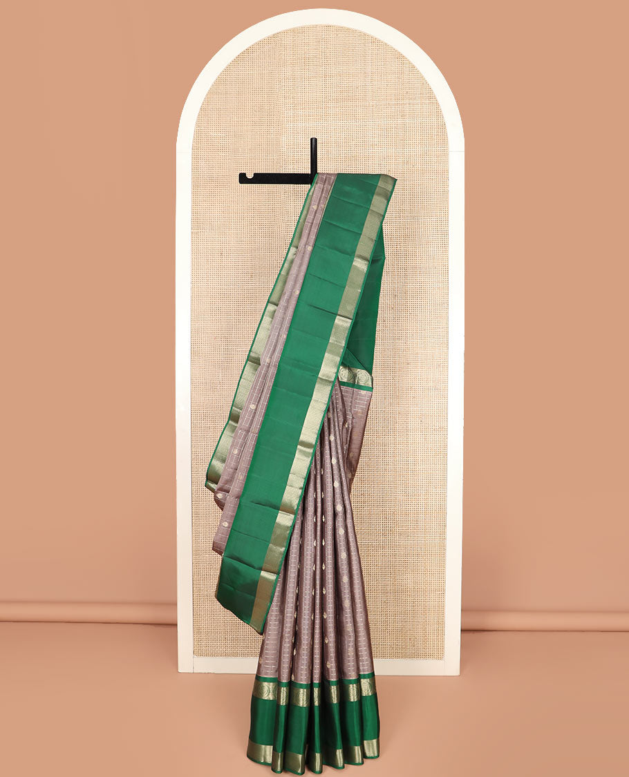Brown Vasundhara Silk Saree Gleamed Up with Zari Butta Enclosed Checks, Complemented by a Contrast Rettai Pettu Blouse of Rekku, Round Mayil, Neli, and Mayil Kann Designs, Pallu Embellished with Jaal Designs, and Paired with a Contrast Blouse