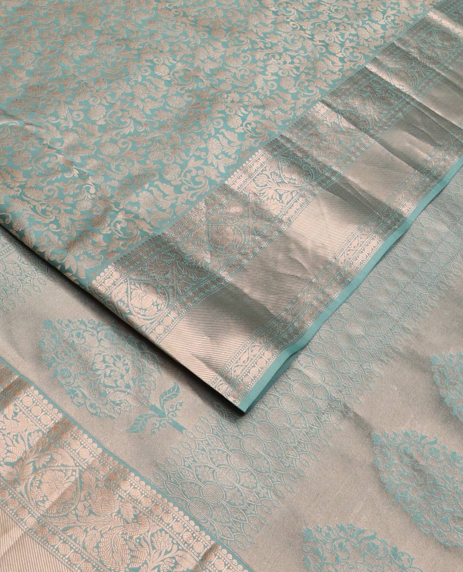 Blue jacquard Kanchipuram wedding silk saree, zari border of thilakam, muthu, poun, banaras, mayil, kodi visiry, leaf vine and zari designs, and intricate pallu