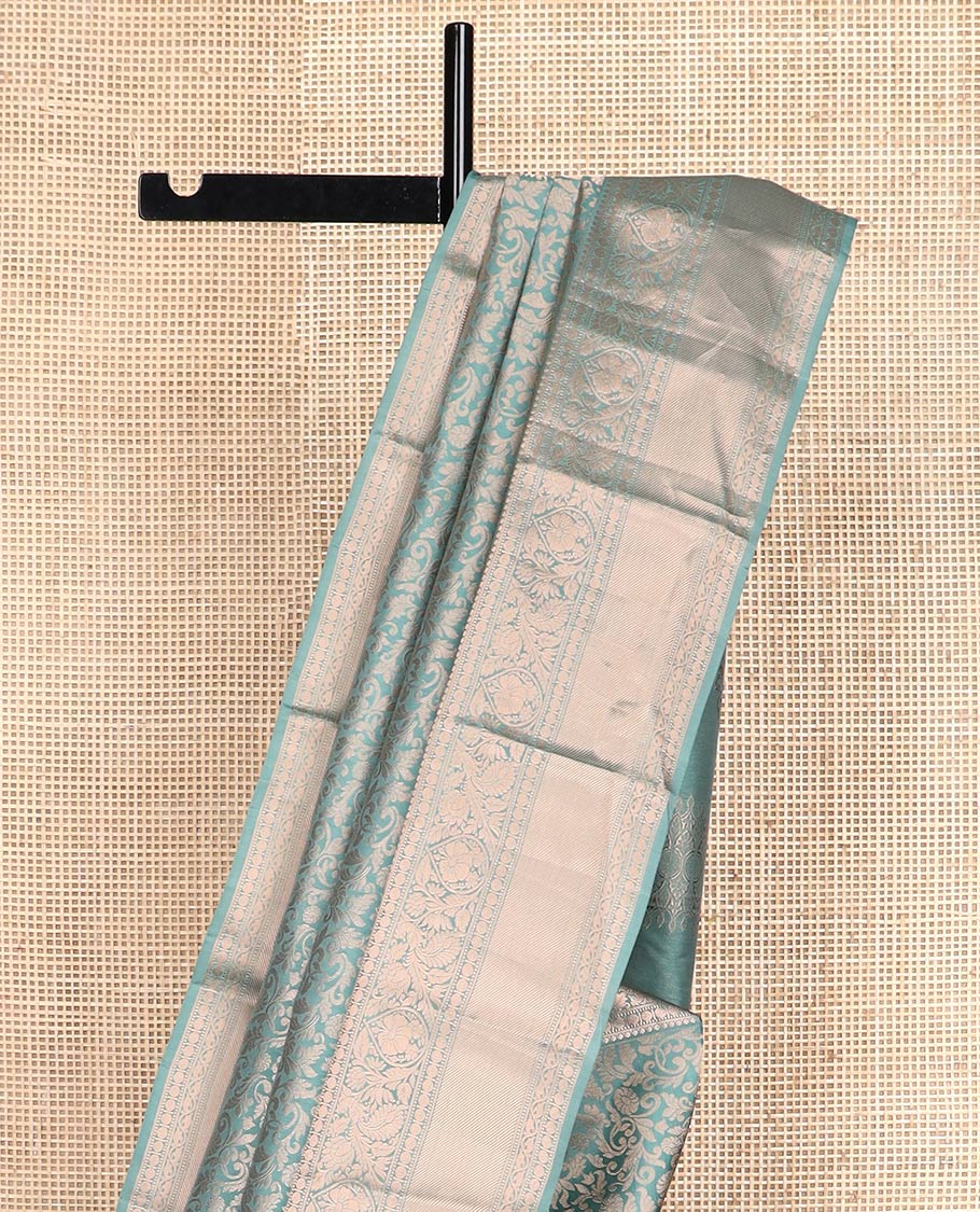 Blue jacquard Kanchipuram wedding silk saree, zari border of thilakam, muthu, poun, banaras, mayil, kodi visiry, leaf vine and zari designs, and intricate pallu