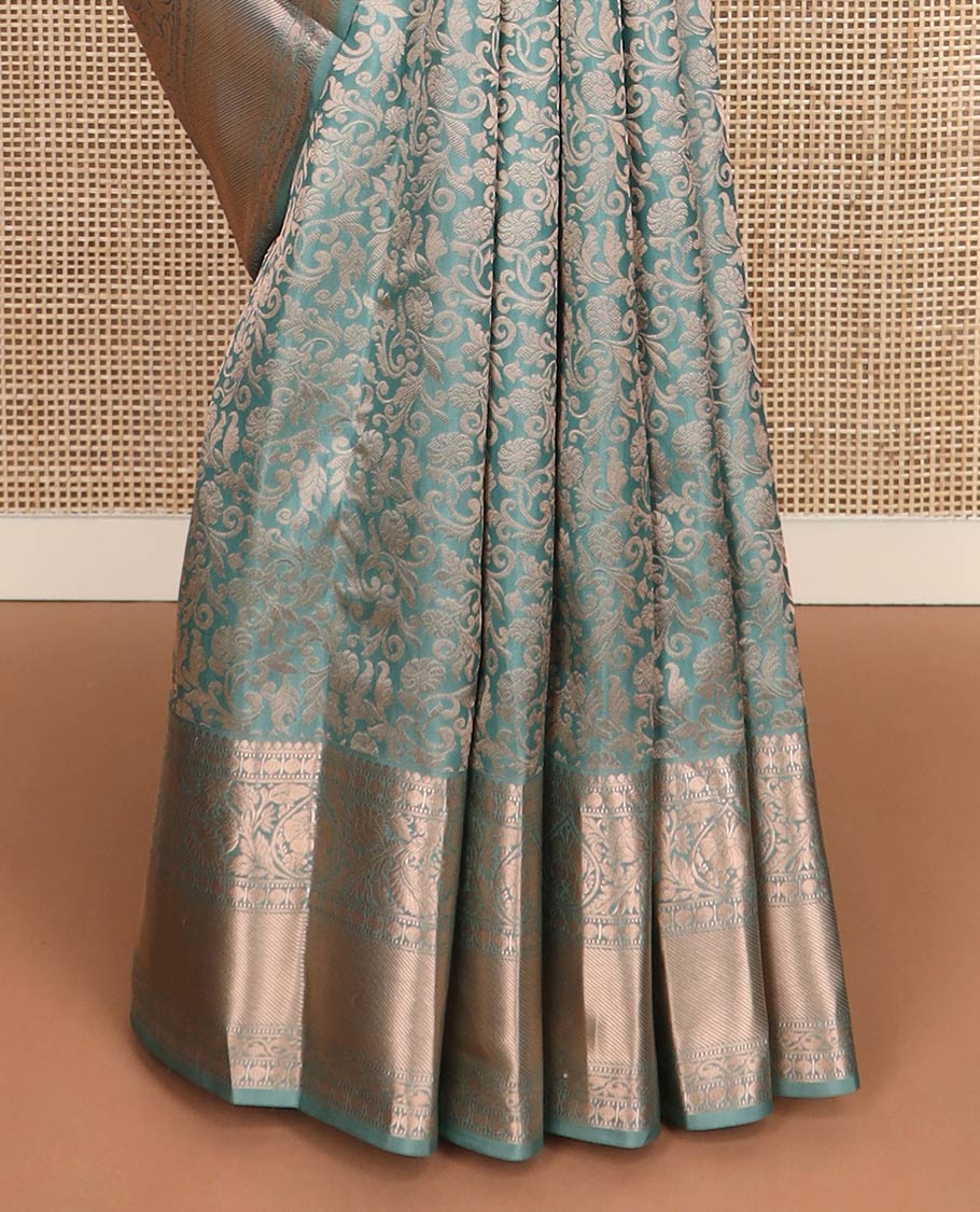 Blue jacquard Kanchipuram wedding silk saree, zari border of thilakam, muthu, poun, banaras, mayil, kodi visiry, leaf vine and zari designs, and intricate pallu