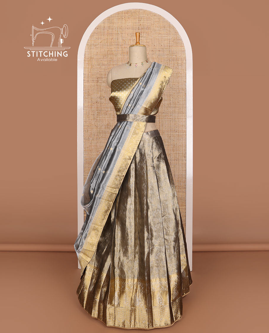 Grey buttas tissue half saree with contrast zari design border, checked design blouse & floral design dhavani