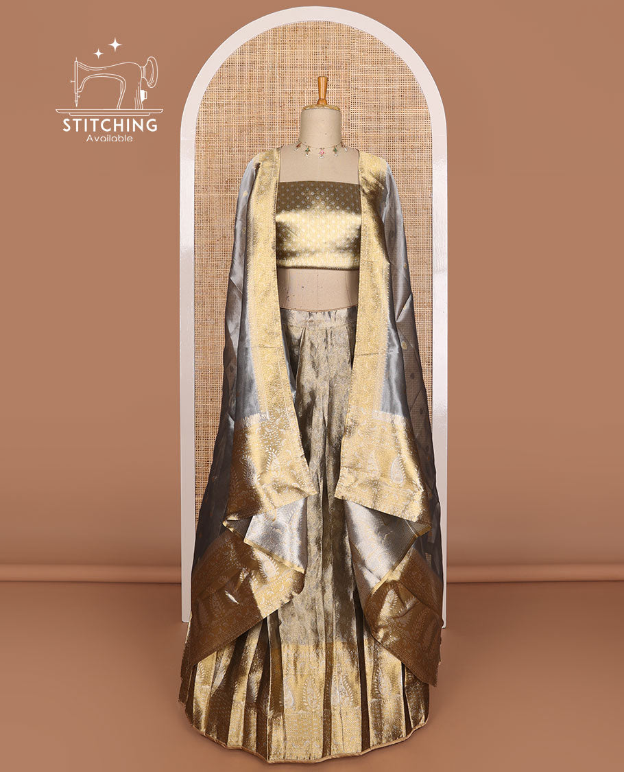 Grey buttas tissue half saree with contrast zari design border, checked design blouse & floral design dhavani