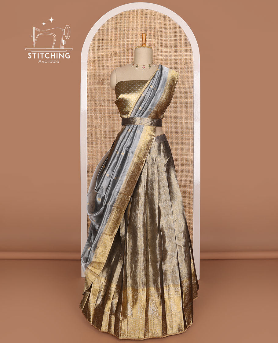 Grey buttas tissue half saree with contrast zari design border, checked design blouse & floral design dhavani