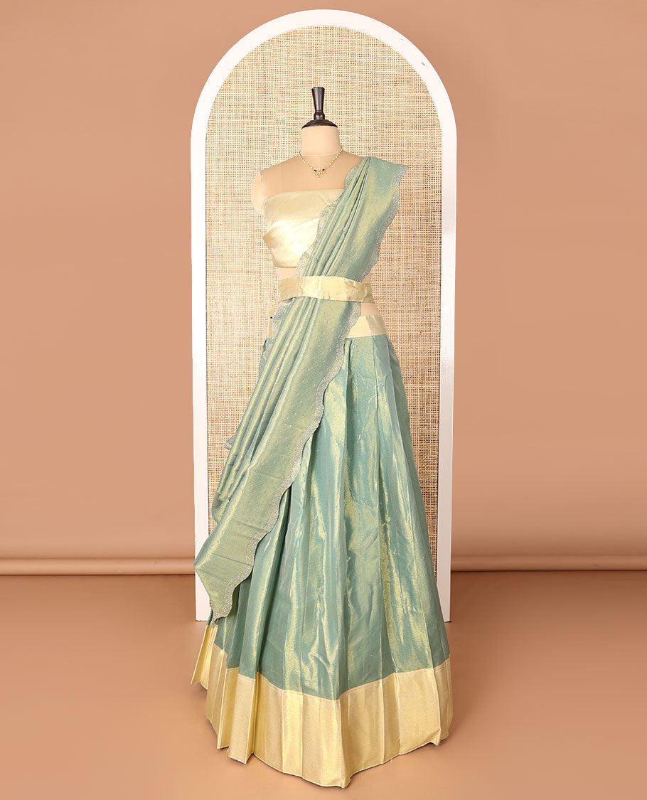 Green art-silk half-saree, plain with contrast bordered skirt, contrast blouse, and a scallop stone work dhavani