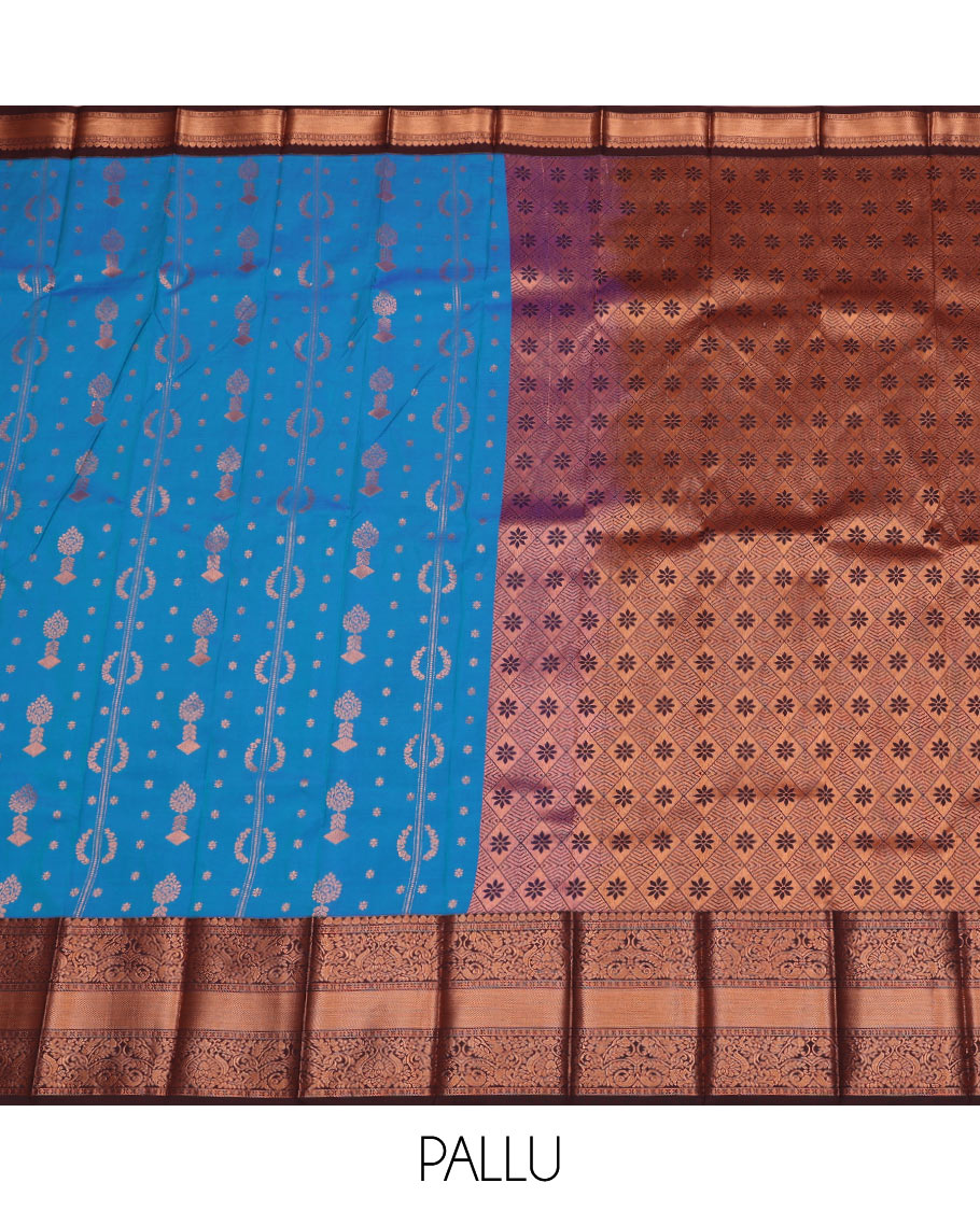 Blue Budget Silk Saree Features Zari Buttas, Complemented by a Contrasting Traditional Zari Design Border, a Pallu Adorned with Jaal Designs, and a Contrasting Zari-Bordered Blouse.