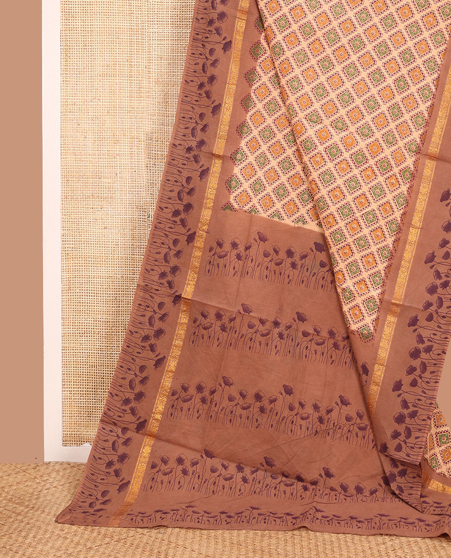 Light Orange Sungudi Cotton Saree Prettified with Diamond Buttas Print, Highlighted by Contrast Zari and Print Work Border of Floral Motifs, and Floral Printed Pallu