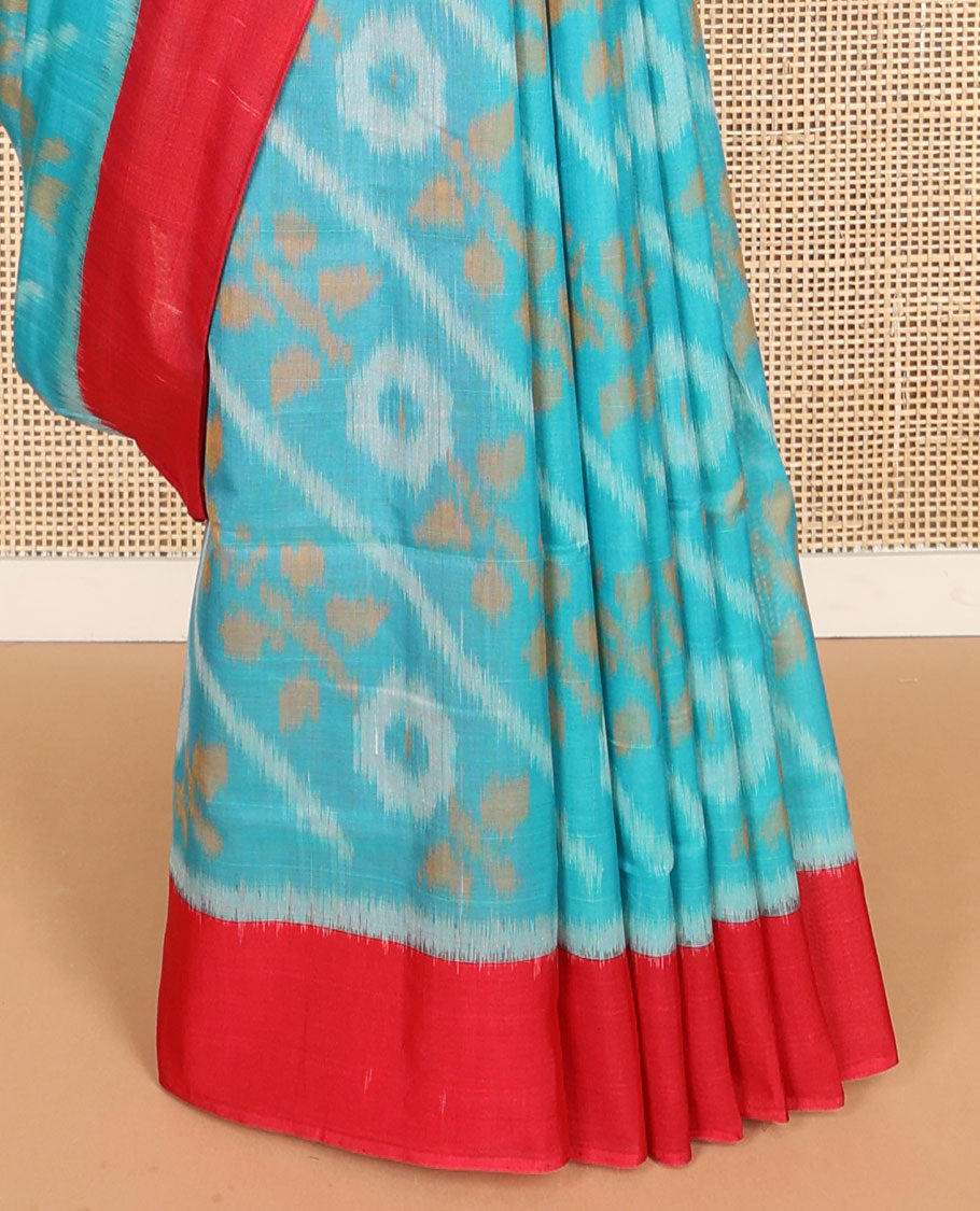 Light blue floral design ikkat cotton saree with contrast border & geometric design pallu